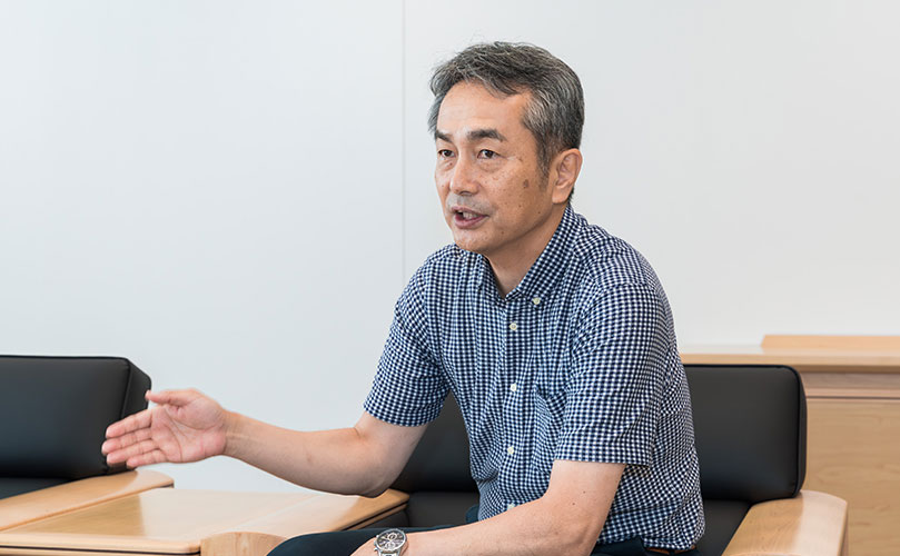 Scene from an interview showing Hideto Okada, SVP, Head of AI Strategy and Business Development Unit, Fujitsu Limited